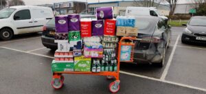 Shopping trolley loaded with food bank donations