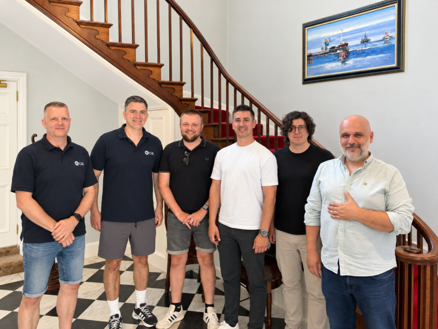 Members of the CIS team standing together in the office