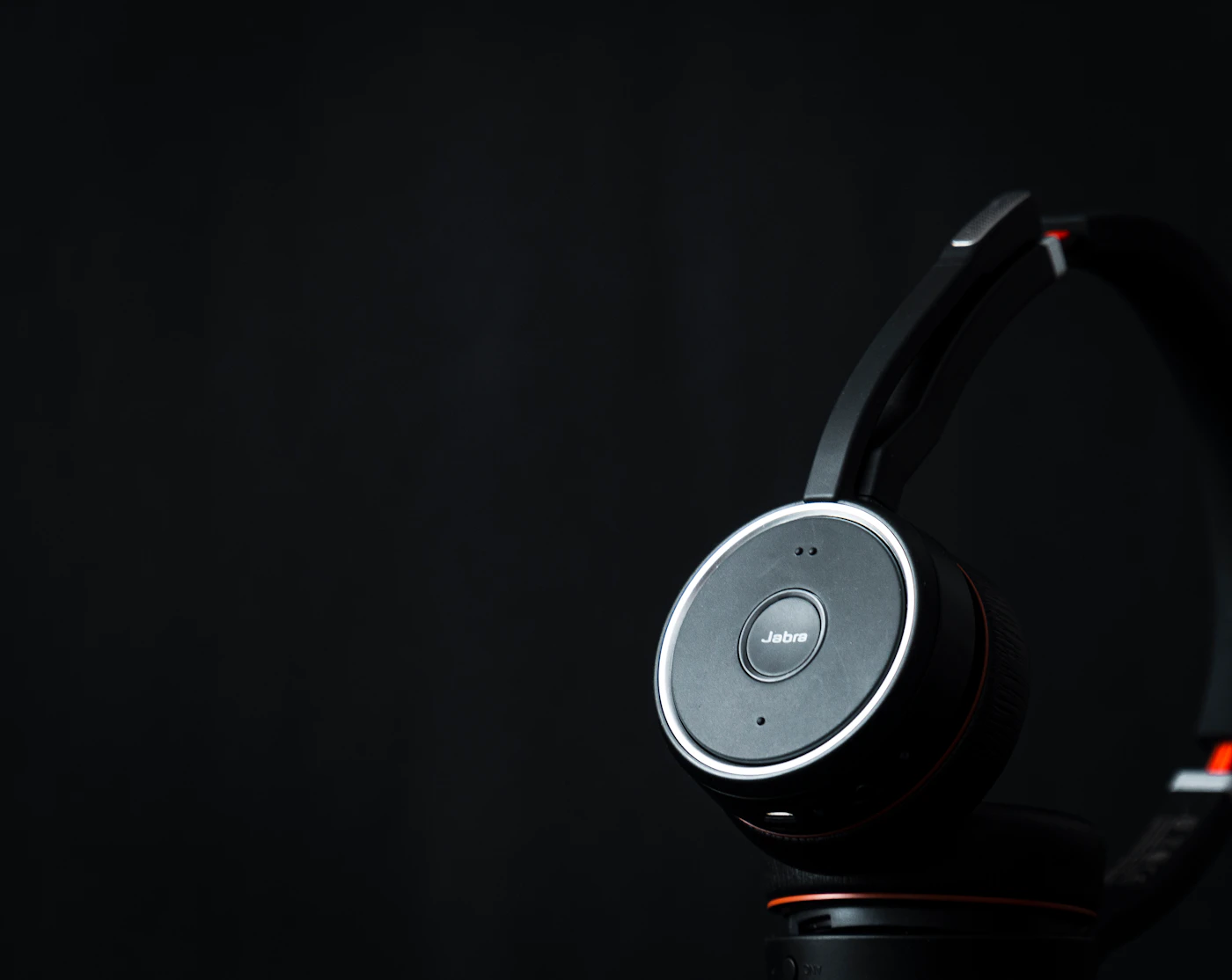 Wireless business headset with a microphone on a desk