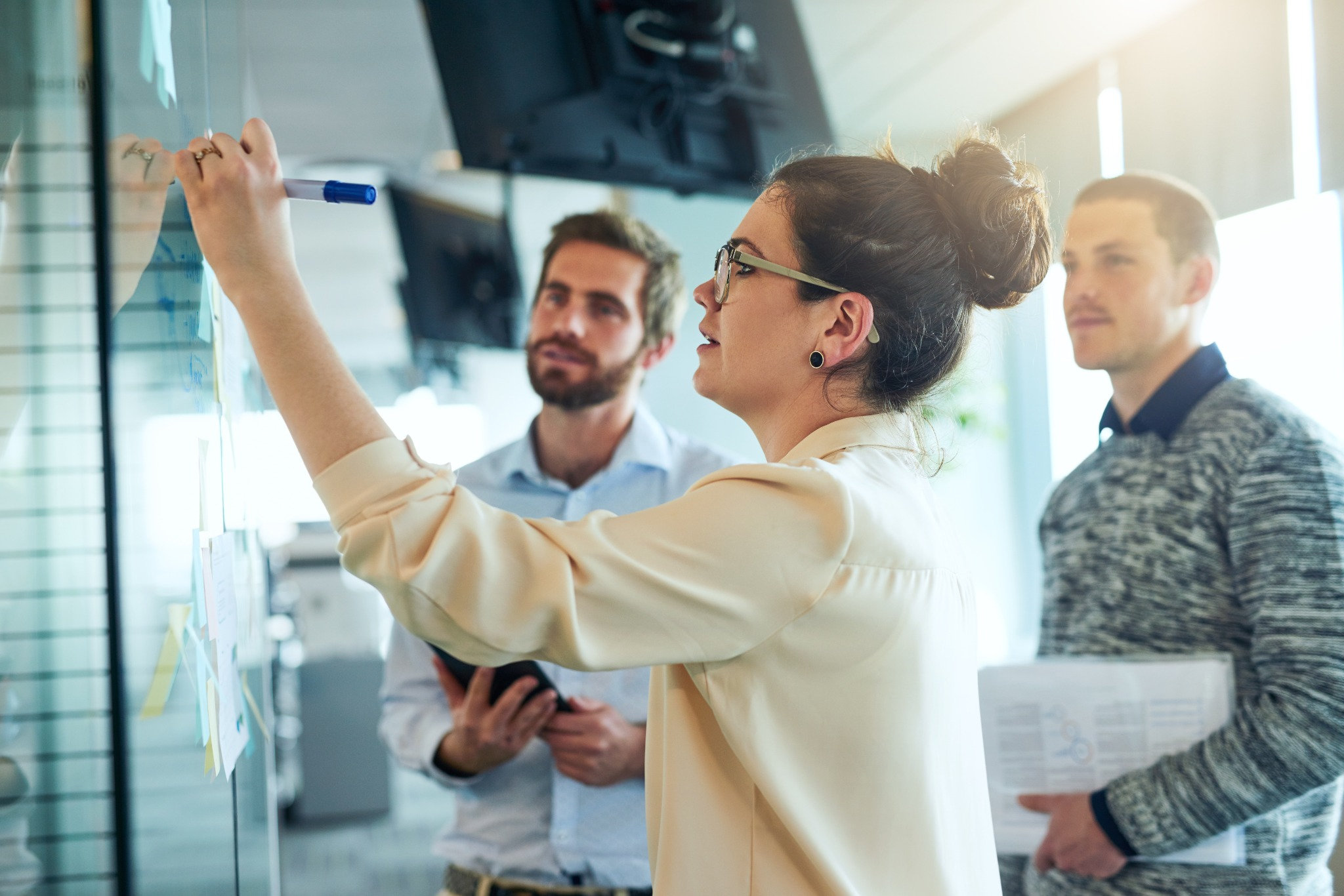 An IT manager and operations director review incident priorities and escalation details while assessing a business IT support company.