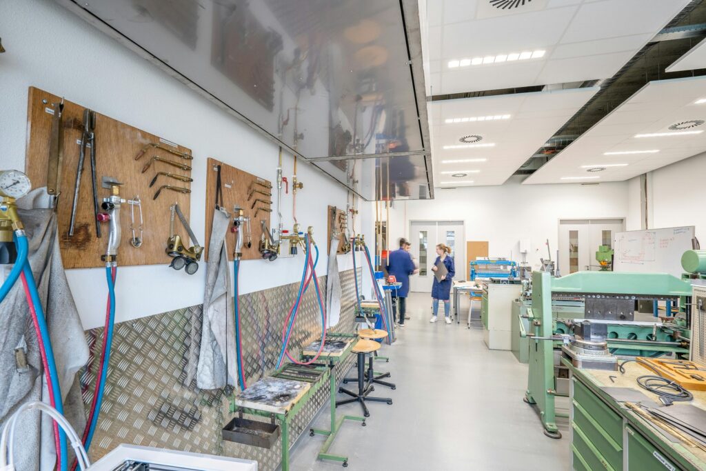 Engineering workshop with tools and machinery.
