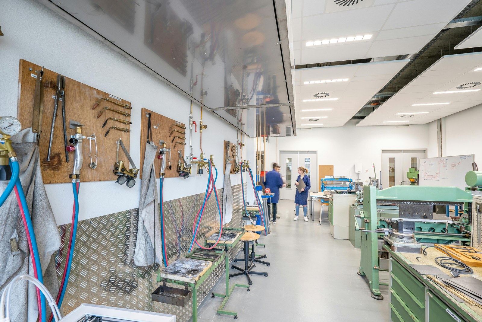 Engineering workshop with tools and machinery.